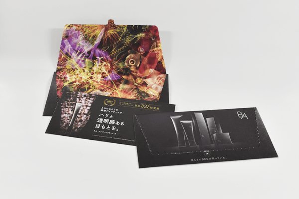 黒と彩りのコントラストで高級感を演出した開封体験DM